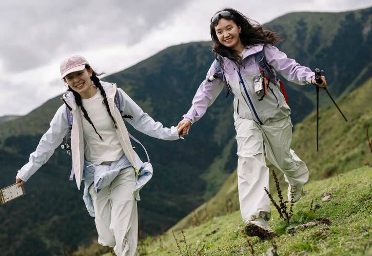 Attendees hiking mountain trails during adidas Mountains Within launch